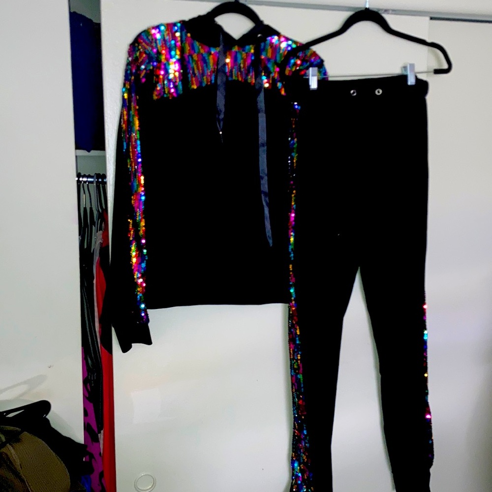 Black tracksuit with multi colored sequins.